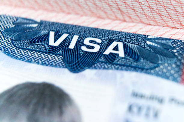 istock Visa stamp travel passport immigration macro emigration 1045053900