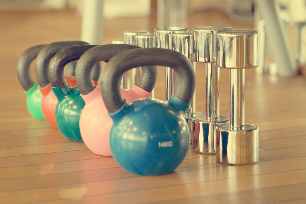 istock Colorful kettlebells in gym 1045065530