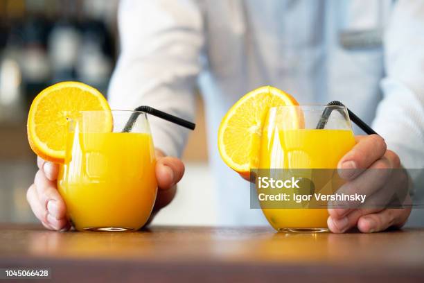 Two Glasses Of Orange Juice Stock Photo - Download Image Now - Orange Juice, Juice - Drink, Drinking