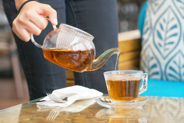 istock The waitress gives tea to the client 1045066456