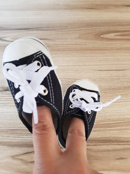 istock Fingers inside children's shoes 1045066916