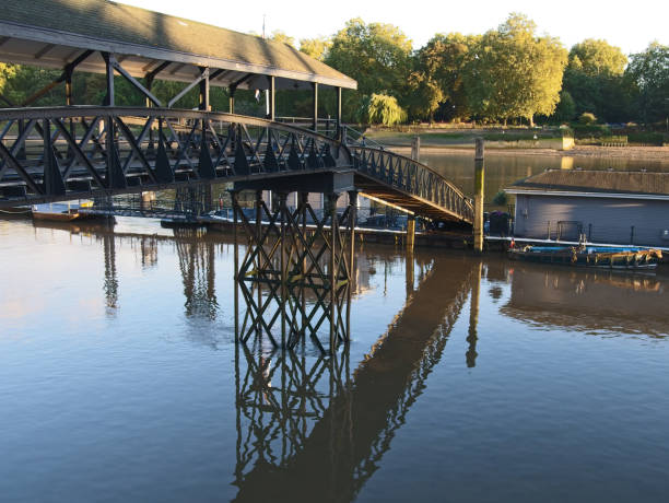 istock River Thames and old rusty steel bridge (pier). 1045072290