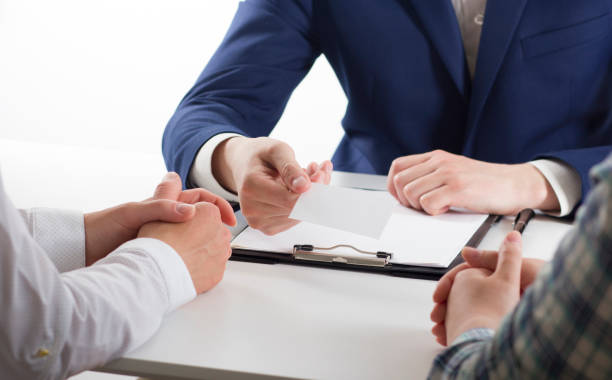 istock business executive exchanging business card blank 1045103438