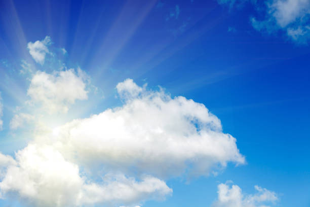 istock clouds against a blue sky with rays of the sun 1045105830