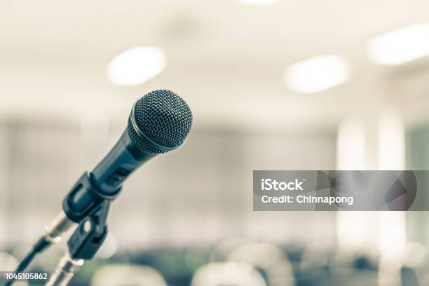 Microphone Speaker In School Lecture Hall Seminar Meeting Room Or Educational Business Conference Event For Host Teacher Or Coaching Mentor Stock Photo - Download Image Now