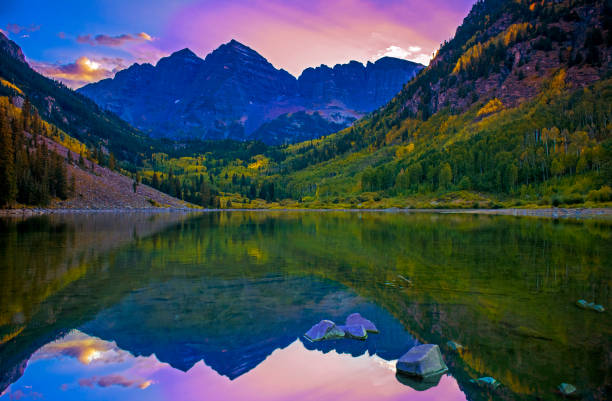 istock Perfect Scenic View Of Mountains At Sunset Over Lake Reflection 1045106542