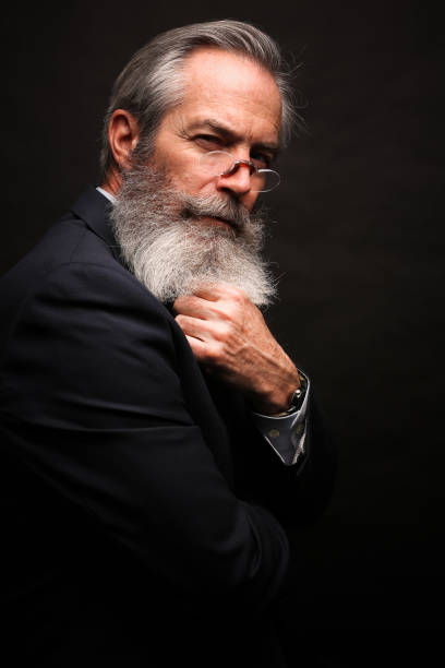 istock mature male model wearing suit with grey hairstyle and beard 1045108884
