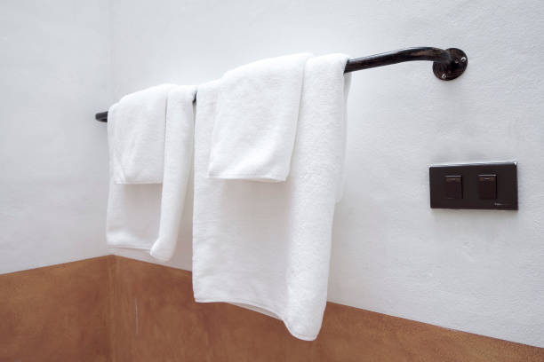 istock white towels on a hanger at bathroom 1045111030