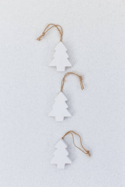 istock White wooden handmade christmas tree toys 1045111178