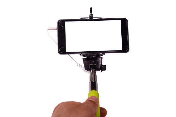 istock Selfie stick with modern smartphone isolated on a white background 1045111410