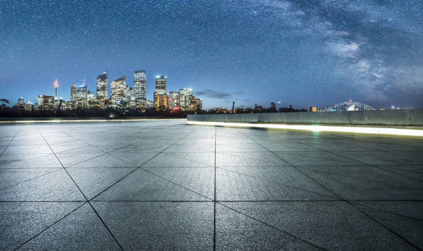 istock empty pavement front of sydney cityscape 1045129214