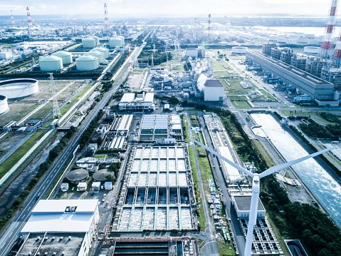 Aerial panorama view of an oil refinery plant with pipelines & storage tanks laid out throughout the factory in a petrochemical industrial estate, in Taoyuan City, Taiwan, Asia (in flat lay mode )