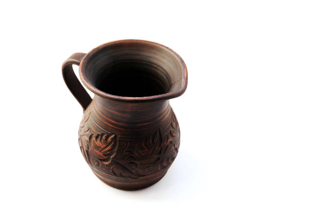 Vintage clay earthenware vase with ornament isolated on white background