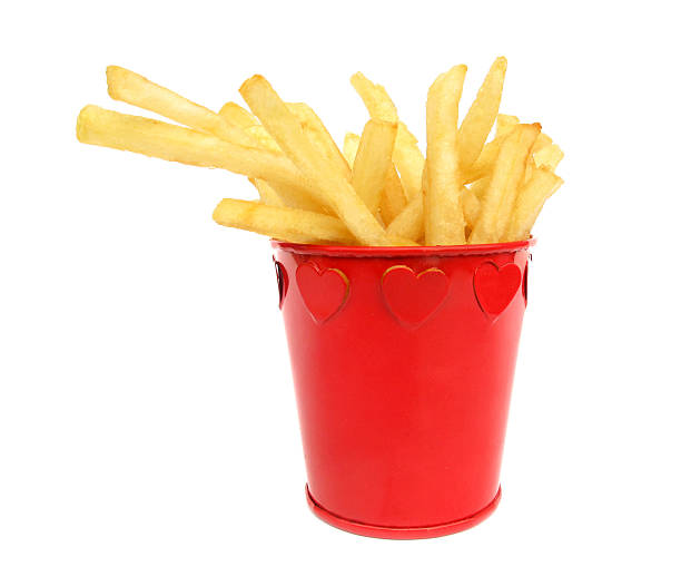 istock French fries potatoes in red box with hearts 104517456