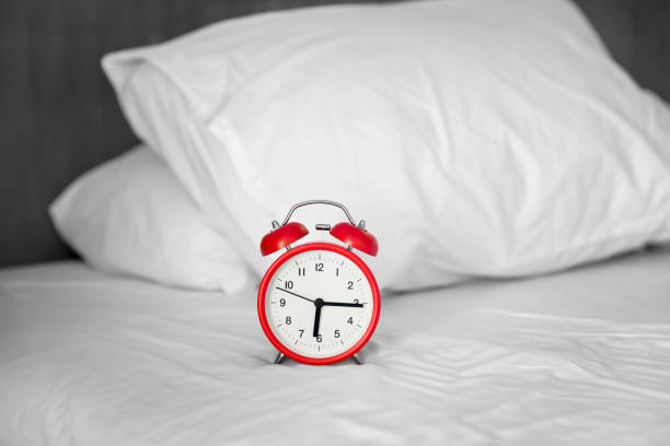 Alarm clock on bedroom interior at 6.15am , Vintage tone