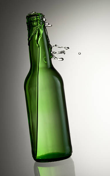 istock Green Bottle and gravity defying liquid 104519544
