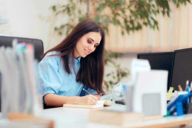 istock Female Desk Job Office Employee Working To Complete Tasks 1045197588