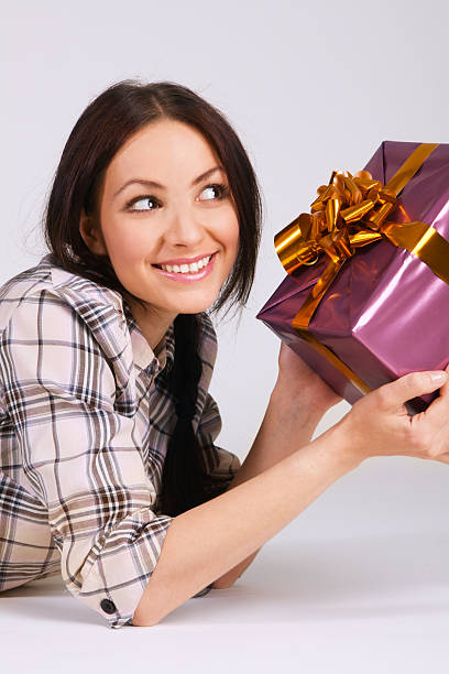 istock Beautiful young woman with a gift box 104520805
