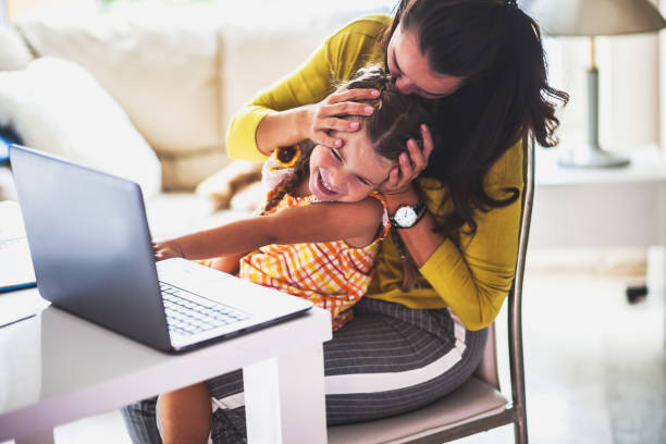 istock Young mother and her little girl using computer 1045210136