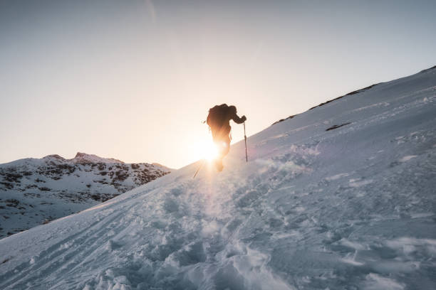 istock Mountaineer climbing on snowy mountain 1045220826