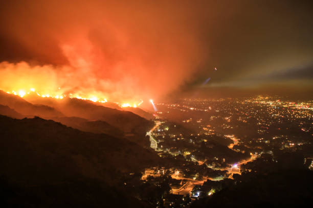 rescue teams evacuating neighborhood from wildfire - natural disaster imagens e fotografias de stock