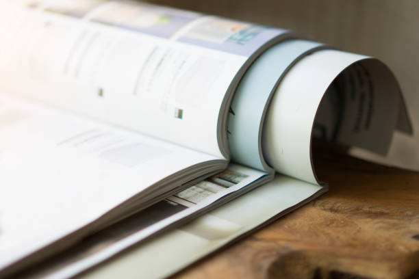 istock Stack of magazines on table living room 1045221790