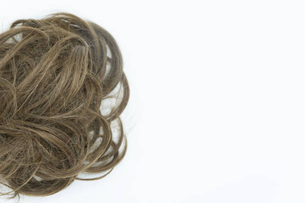 istock Curly hair isolated on white background. Right copy space. 1045224784