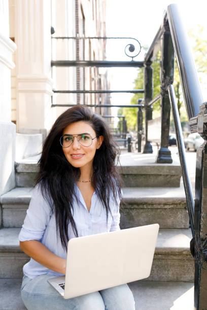 istock Woman Working On Laptop Outdoors 1045224968