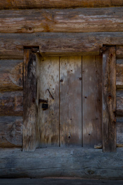 istock Old wooden door with large lock 1045225392