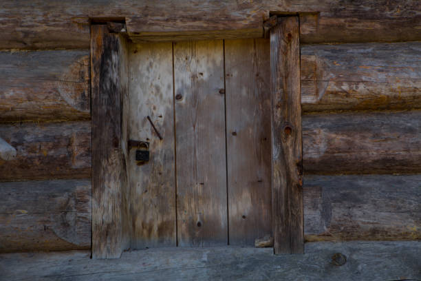 istock Old wooden door with large lock 1045225426
