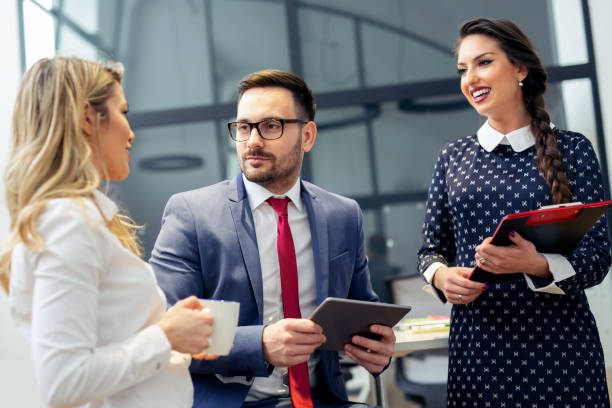 istock Group of business persons in discussion 1045239352