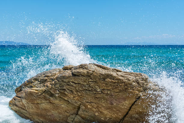 istock Rock and sea waves 1045245684