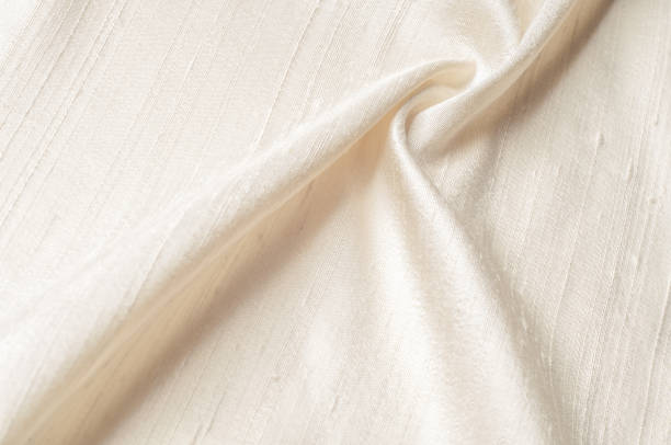 istock Texture background pattern. Linen fabric Light beige. Light brown linen cloth texture for the background. 1045253898