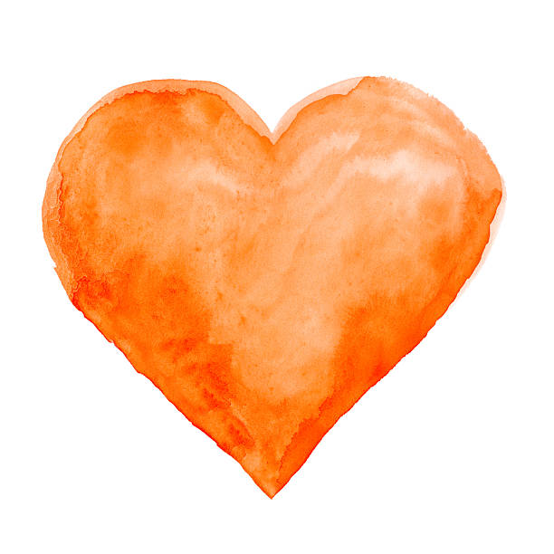 Orange water colored heart against white background stock photo
