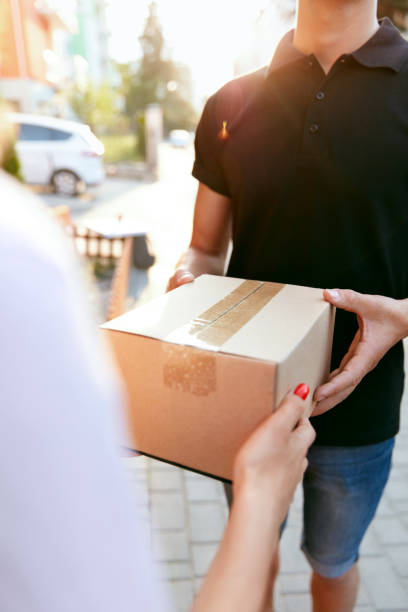 istock Courier Delivery Service. Closeup Hands Receiving Package 1045256890