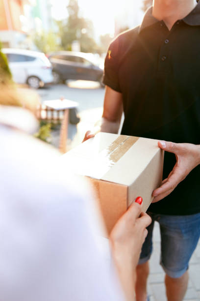 istock Courier Delivery Service. Closeup Hands Receiving Package 1045257080