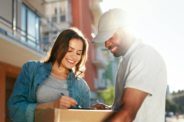 istock Courier Delivery Service. Man Delivering Package To Woman 1045263028