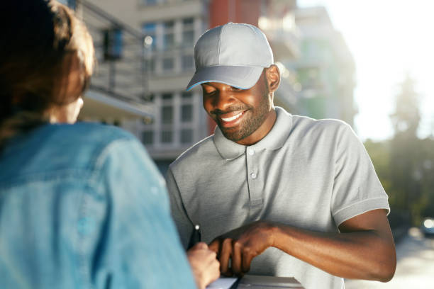 istock Courier Delivery Service. Man Delivering Package To Woman 1045263046