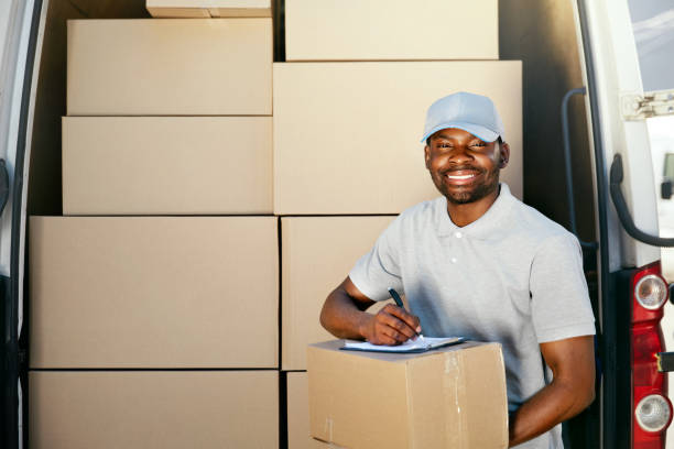 istock Courier Service. Delivery Man With Boxes Near Car 1045263522