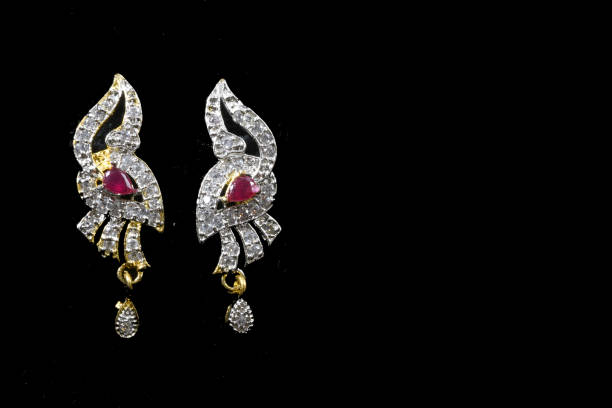 istock Fancy designer Diamond earring set closeup macro image on black background 1045266390