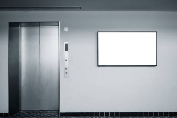Blank digital LCD screen on wall Indoor Building with elevator stock photo