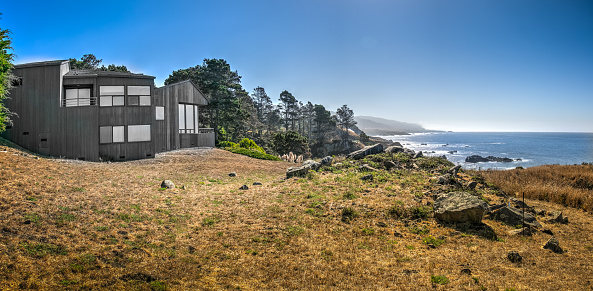 house by pacific ocean in Sonoma Mendocino California on sunny day by ocean