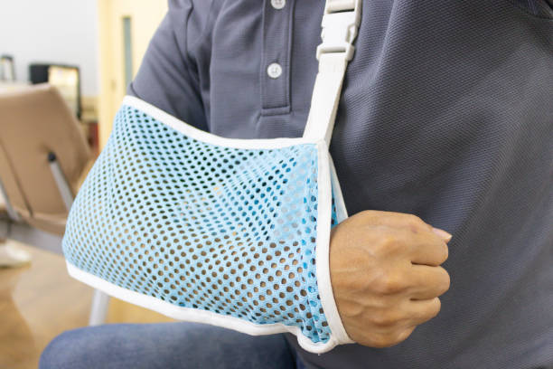 istock Arm of wounded man who is wearing a hanging mesh 1045273284