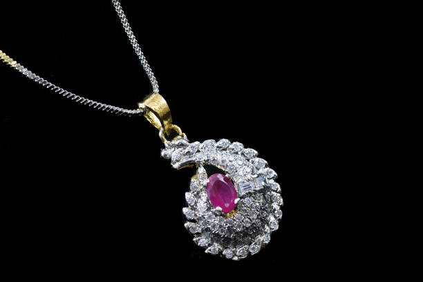 istock Fancy designer Diamond Chain pendent with earrings closeup macro image on black background 1045273768