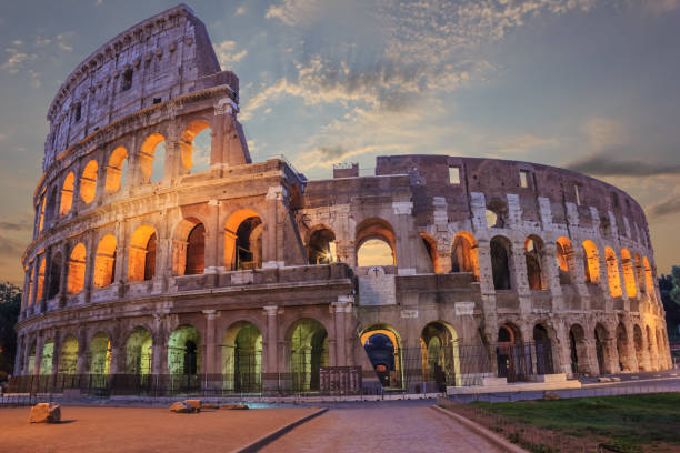 istock Roman Coliseum enlighted in the evening under the clouds 1045274174