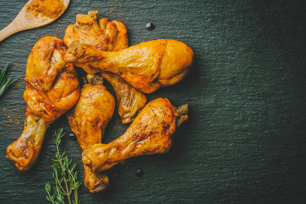 istock Roasted barbeque chicken legs on slate 1045278914