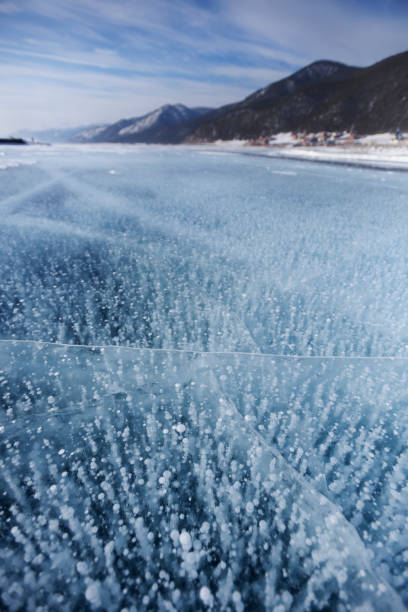 istock Bubbles in ice. Baikal lake. Winter landscape 1045279328