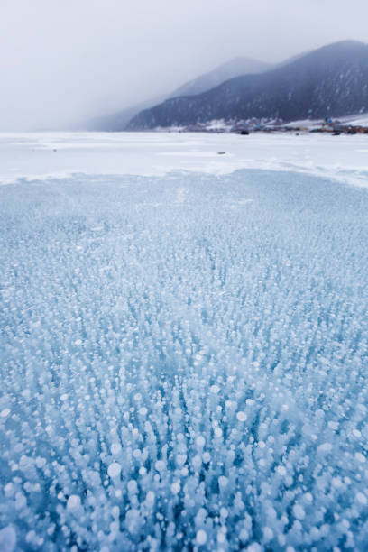 istock Bubbles in ice. Baikal lake. Winter landscape 1045279466
