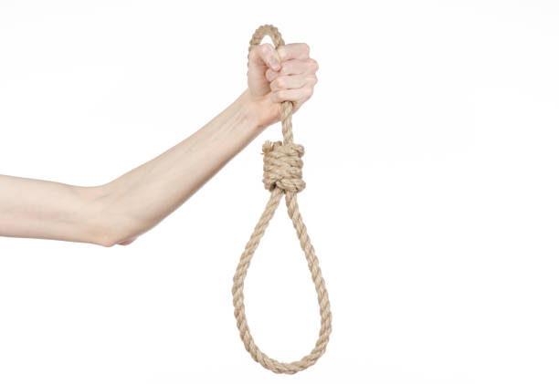 istock Lynching and suicide theme: man's hand holding a loop of rope for hanging on white isolated background 1045280070