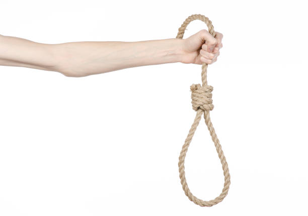 istock Lynching and suicide theme: man's hand holding a loop of rope for hanging on white isolated background 1045281938